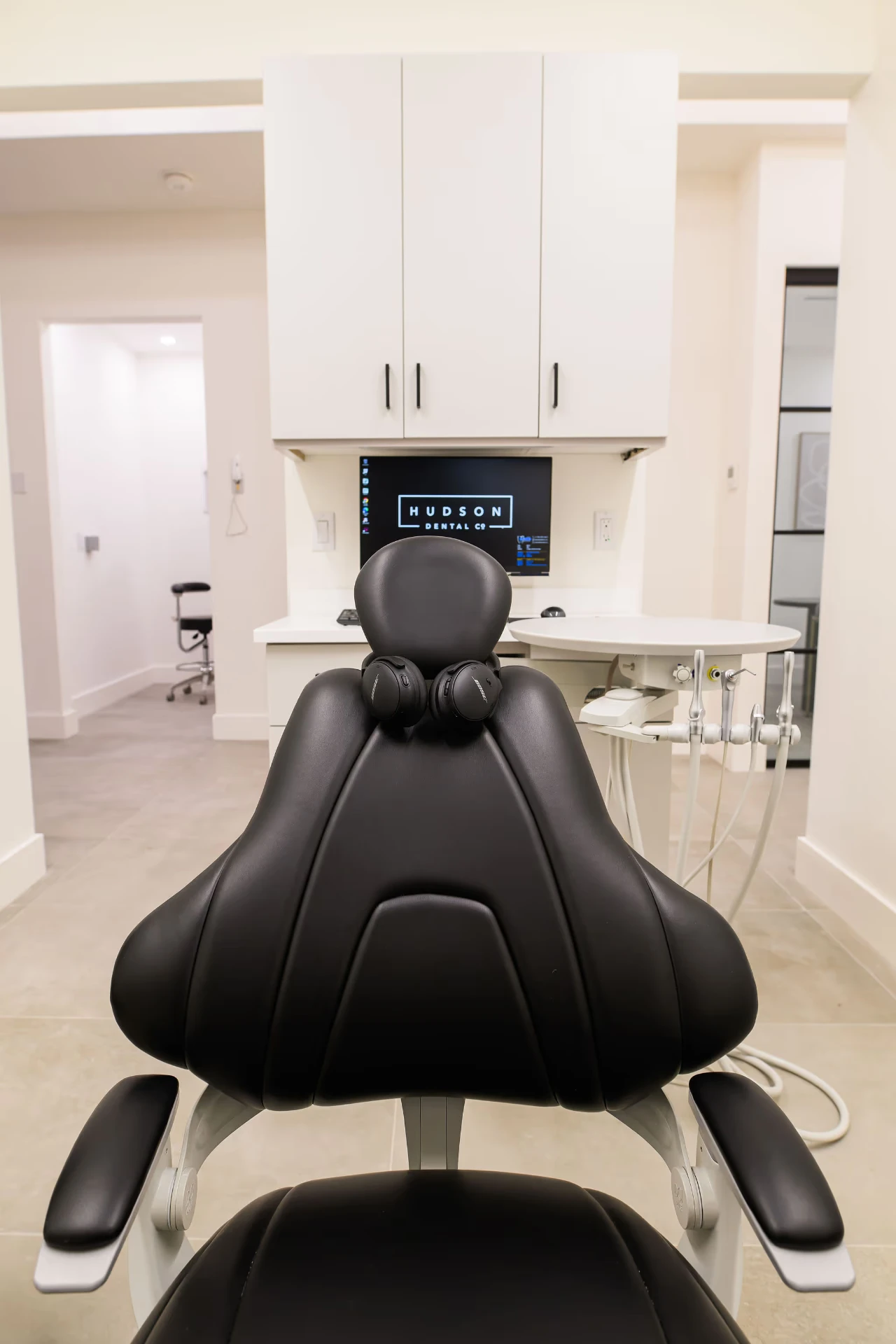 Treatment chair at Hudson Dental Co. with noise-cancelling headphones